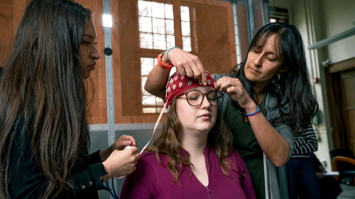 A volunteer having electrodes attached to the head by researchers