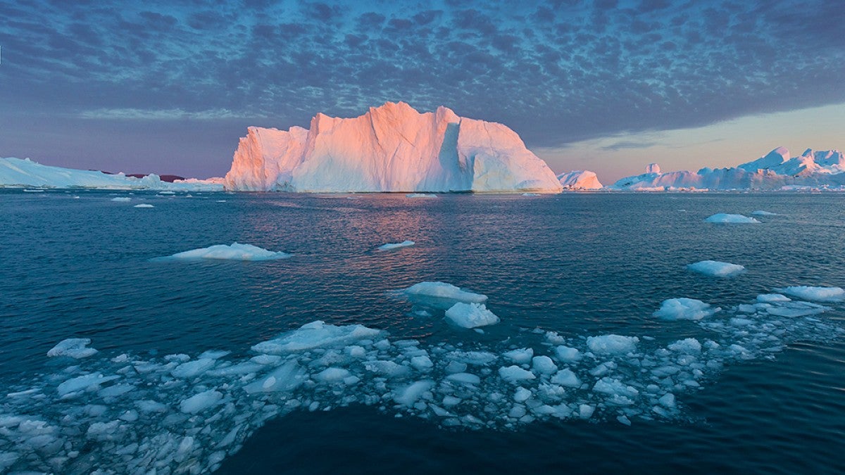 Large iceberg illuminated by the setting sun