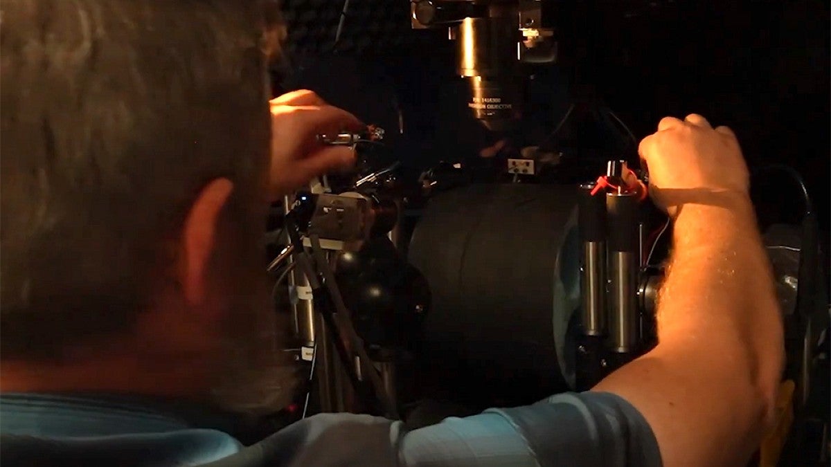 Evan Vickers working with equipment in a lab