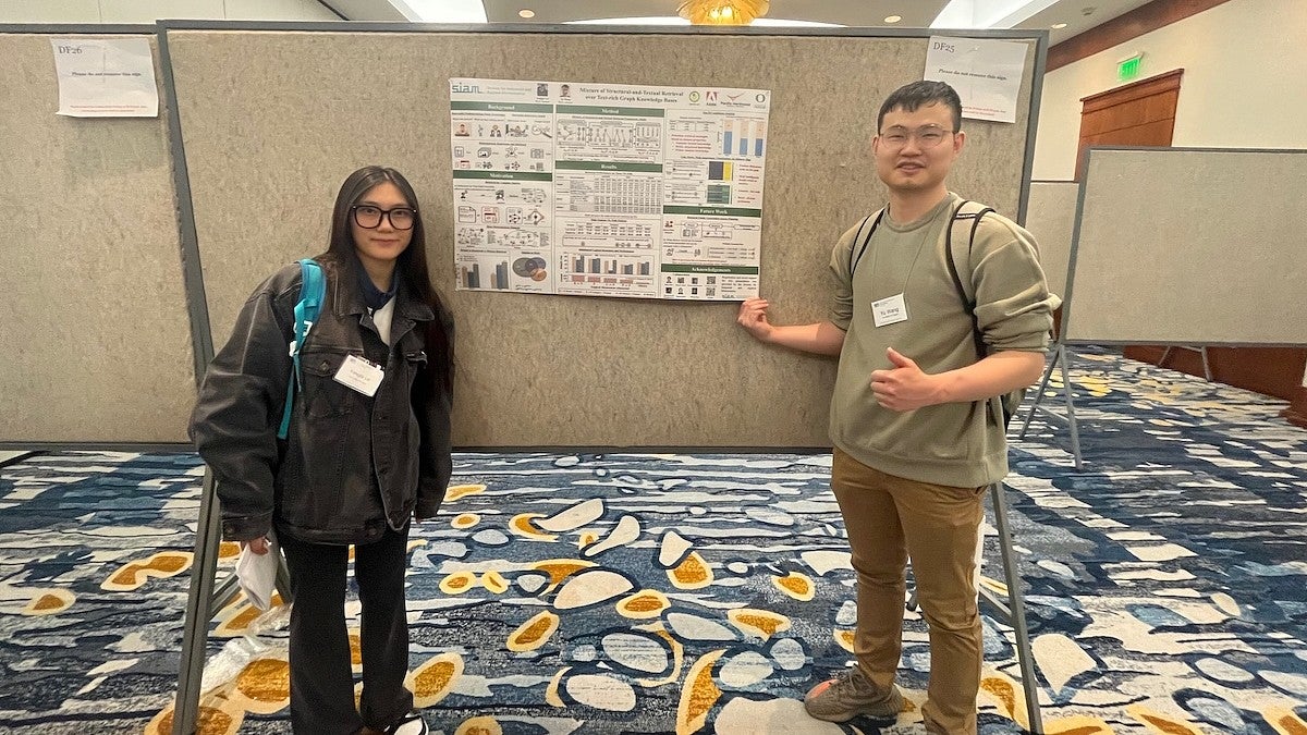 Assistant Professor Yu Wang's (right) research involves using machine learning to model enormous sets of data to link data