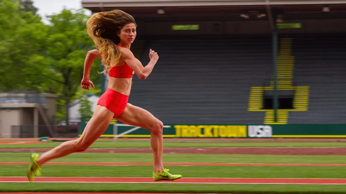 a person running on the old hayward field