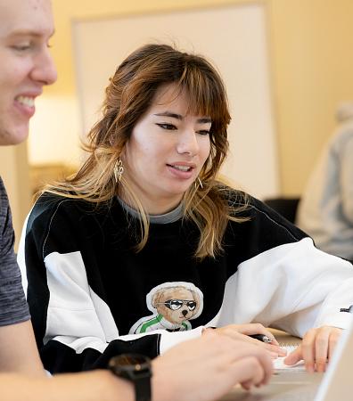 two people looking at computer