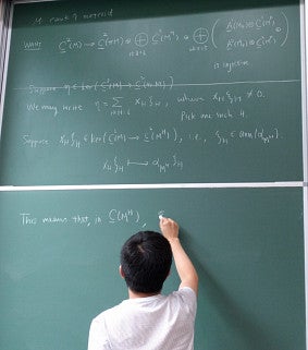 June Huh writes on a chalkboard