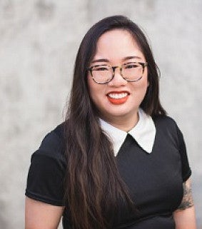 woman smiling wearing glasses