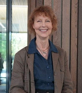 Woman standing in front of a window