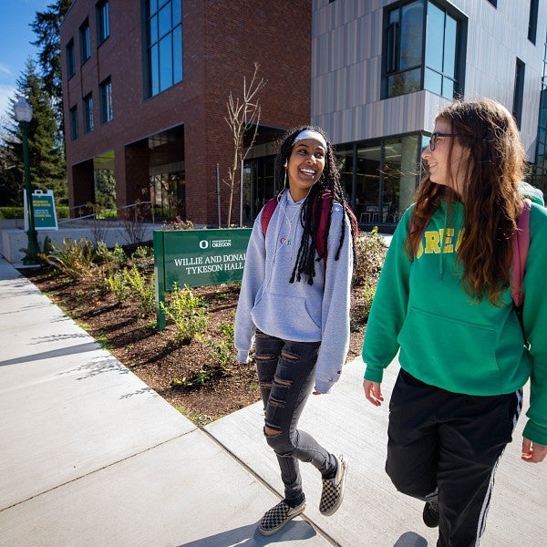 two students walking outside