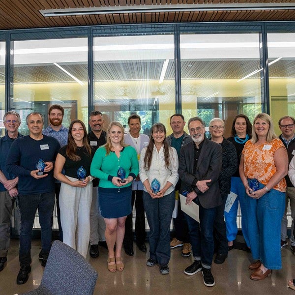 Group of CAS award winners posing together 